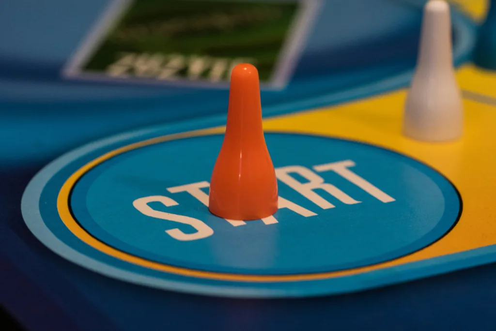 orange coloured counter at start of a board game