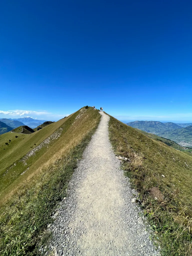 Path at the summit of a mountain. Achieve your goals with Rachel Bamber Brighter Thinking.