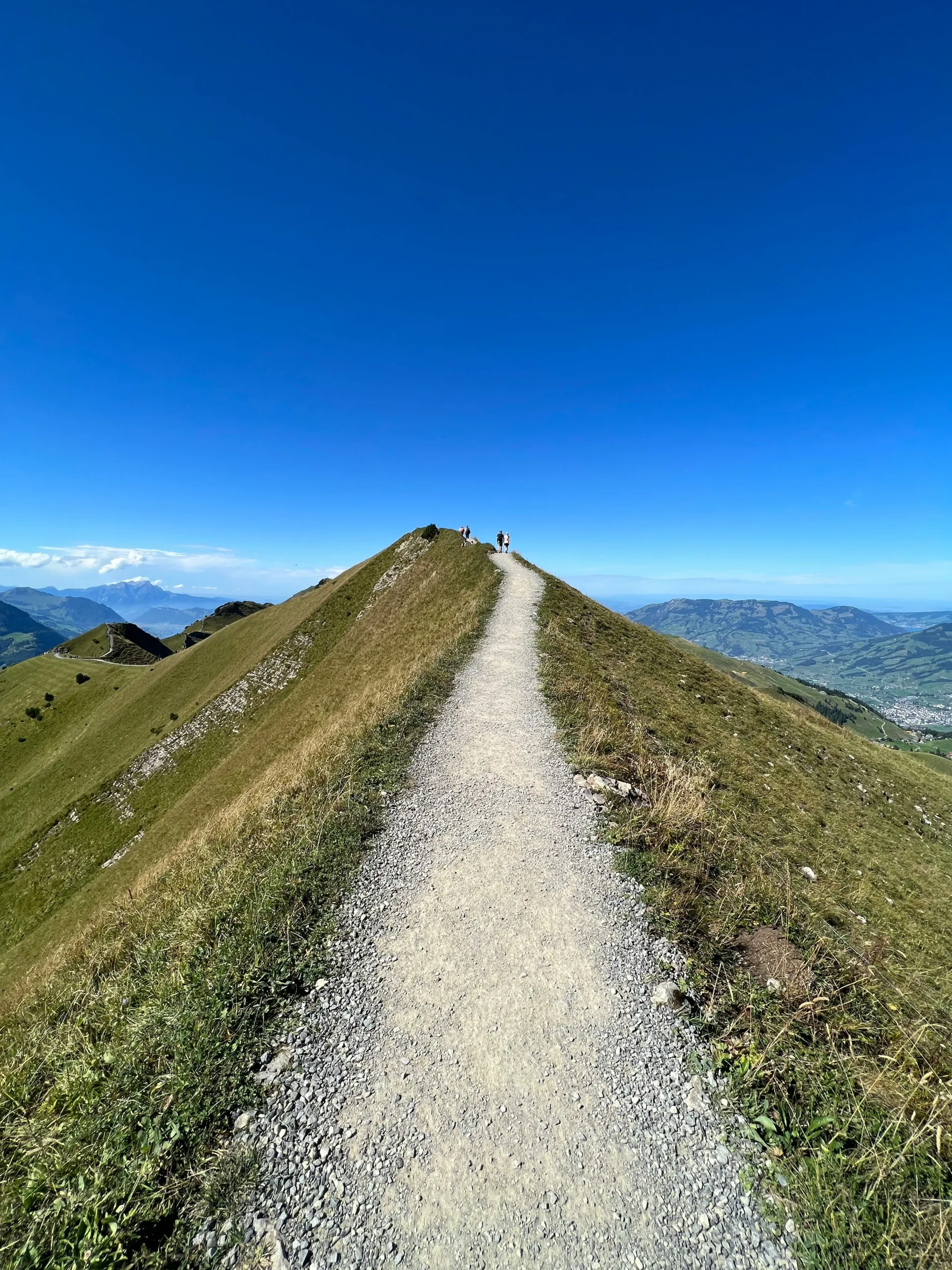 Path at the summit of a mountain. Achieve your goals with Rachel Bamber Brighter Thinking.